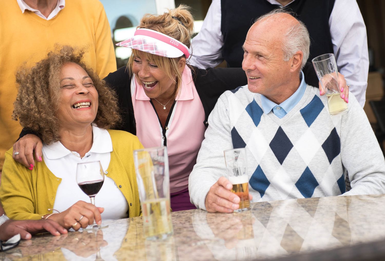 friends at an event_golf_senior_relaxed_bar_Leeds